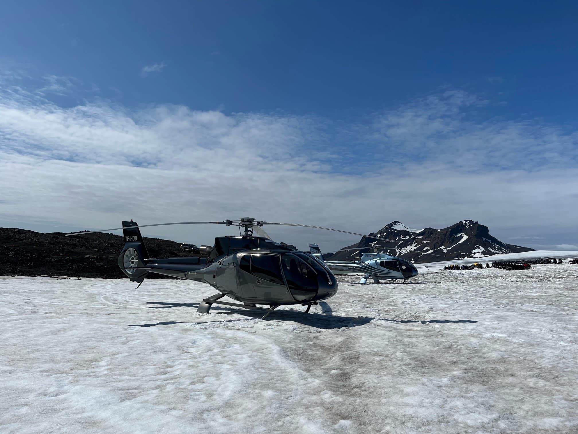 Person taking picture in a helicopter