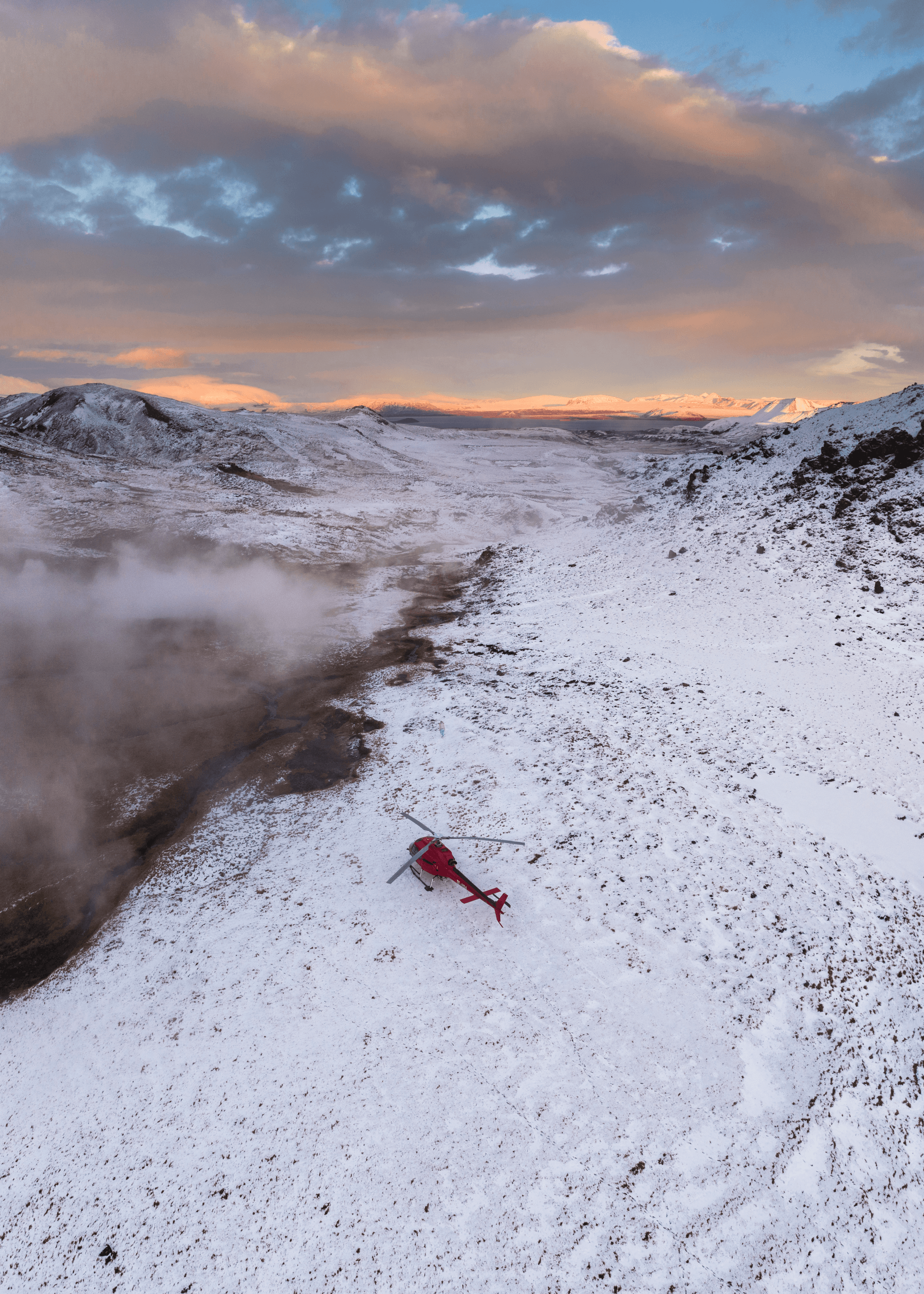 Helicopter flying over a mountain range