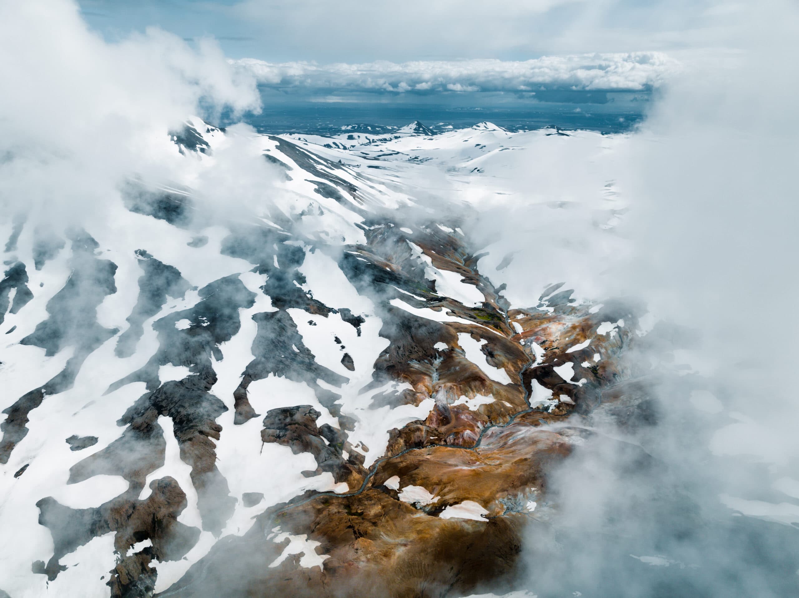 Helicopter flying over a mountain range