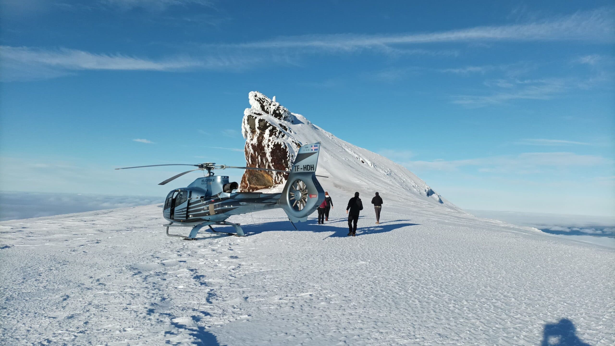 Helicopter flying over a mountain range