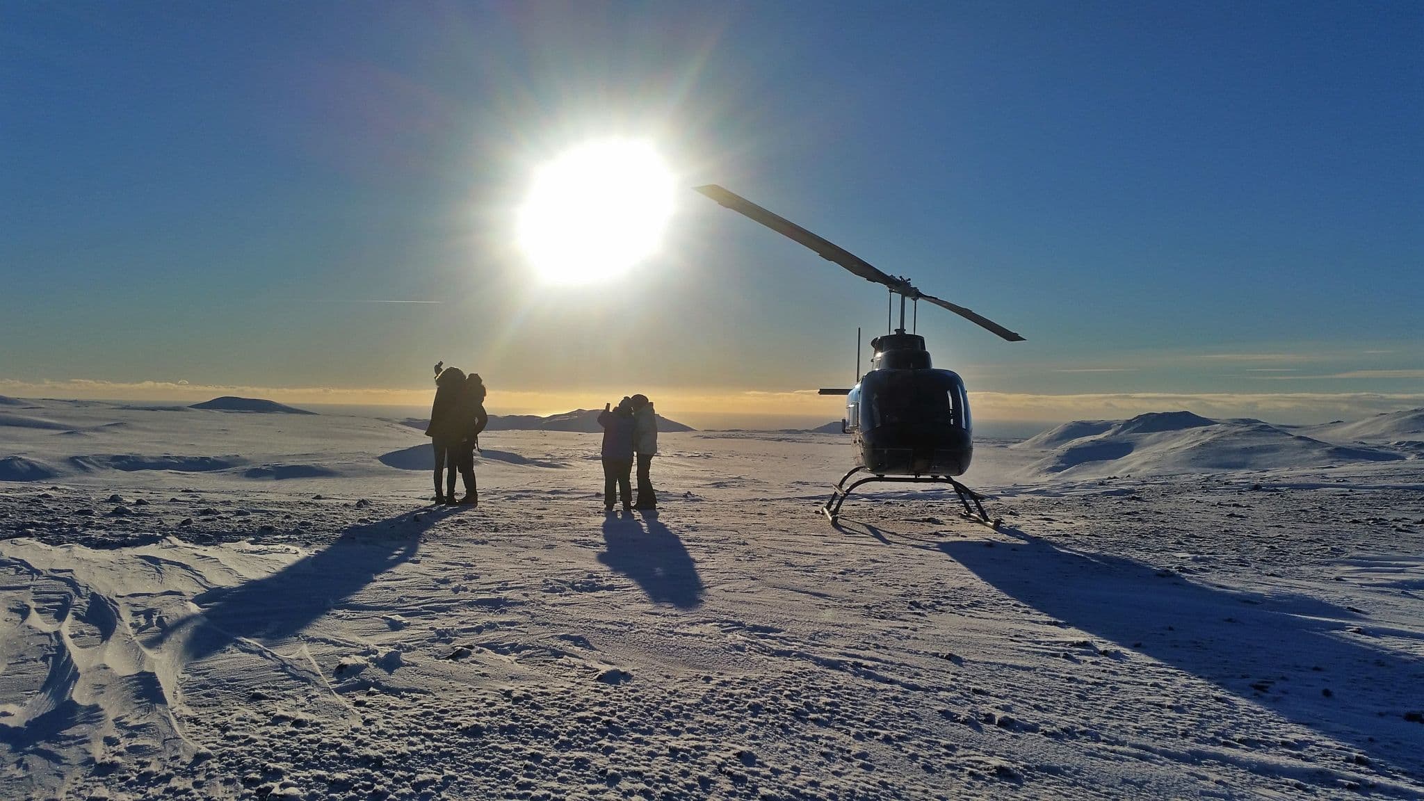 Helicopter flying over a mountain range