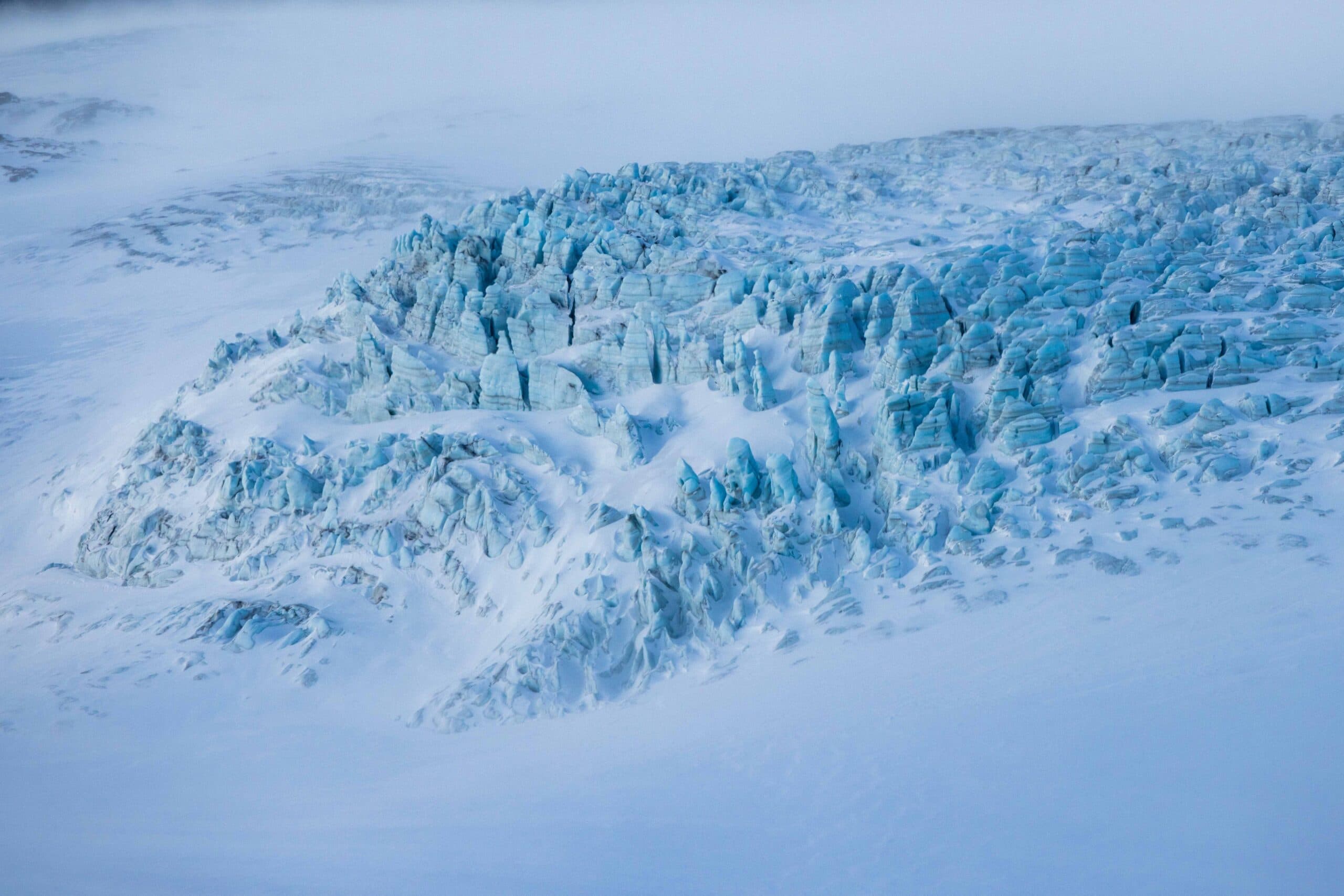 Helicopter flying over a mountain range