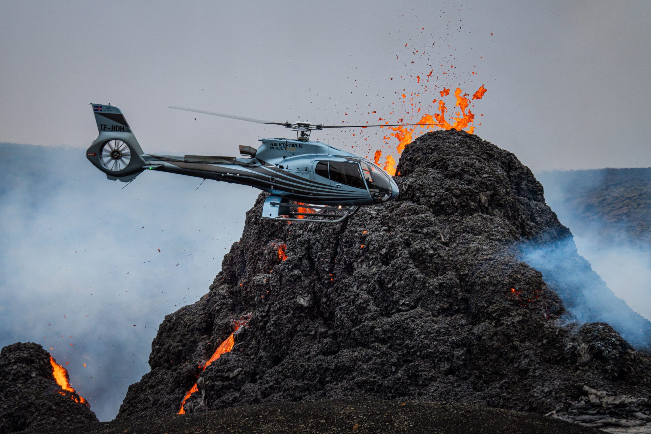 Person taking picture in a helicopter